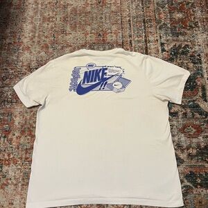 Nike Men's White Tee with Blue Graphic